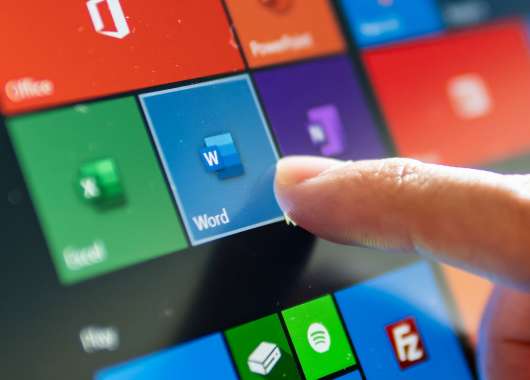 A finger tapping an antivirus app on a touch screen